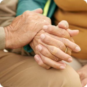 Adult Home Foster Care Caretaker and Patient Holding Hands